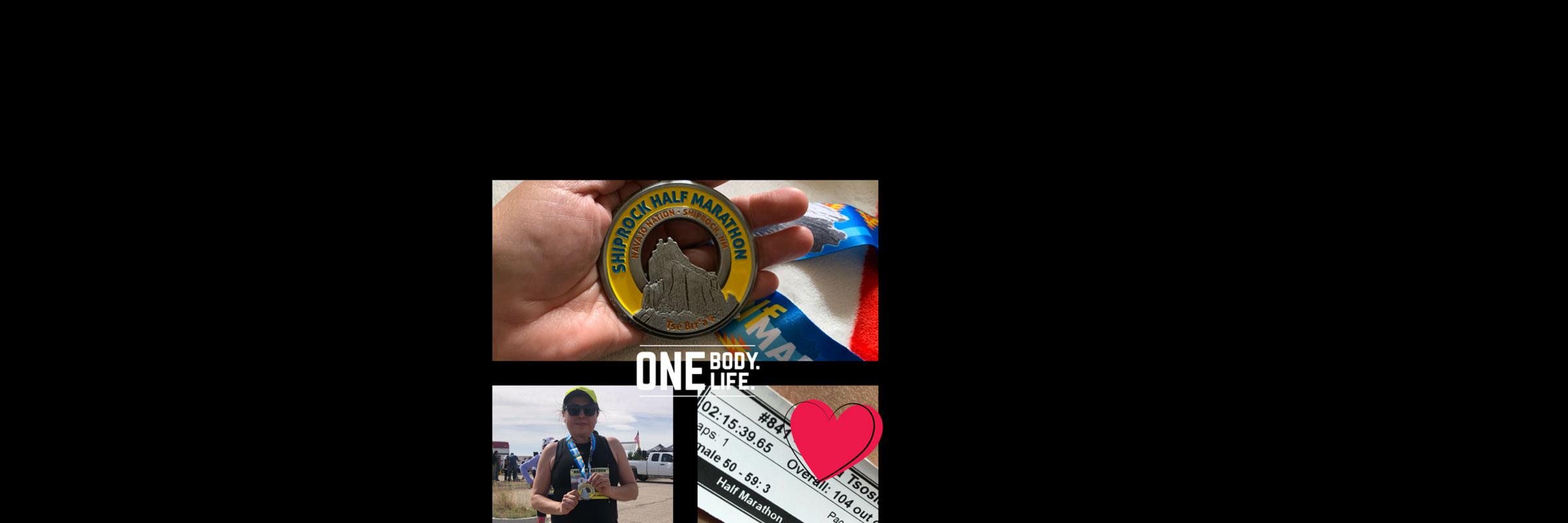 Tsosie at Shiprock with Half Marathon medal.